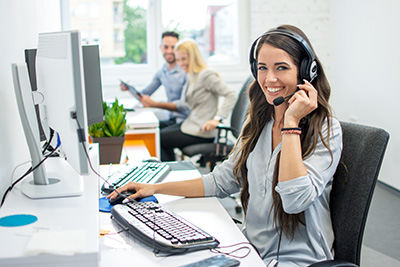 NCR dealers in NJ employee wearing headset assisting clients